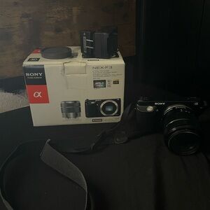 Sony Nex-F3 black camera with a 30mm lensm